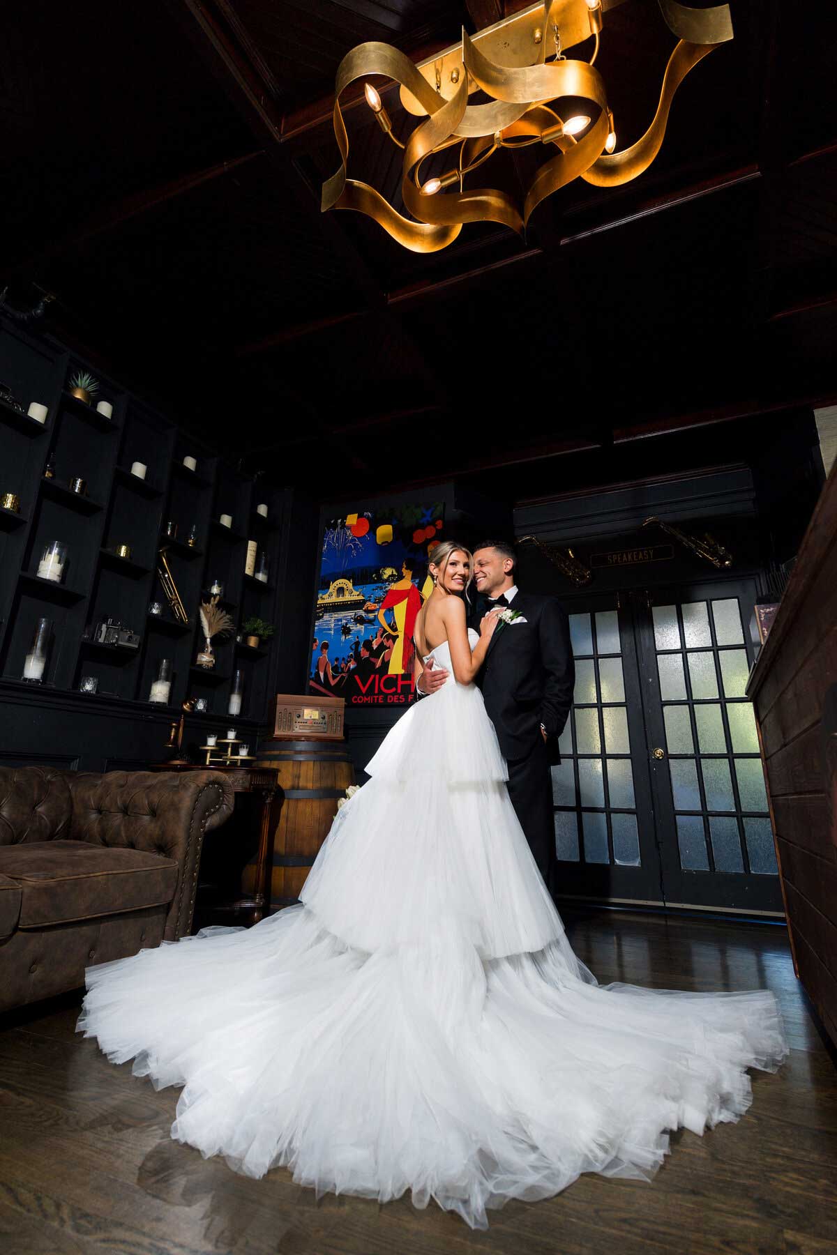 bride-and-groom-speakeasy-at-sea-cliff-manor A man and woman in a wedding dress.