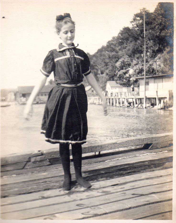 girl-Sea-Cliff-Ny A girl standing on a dock.
